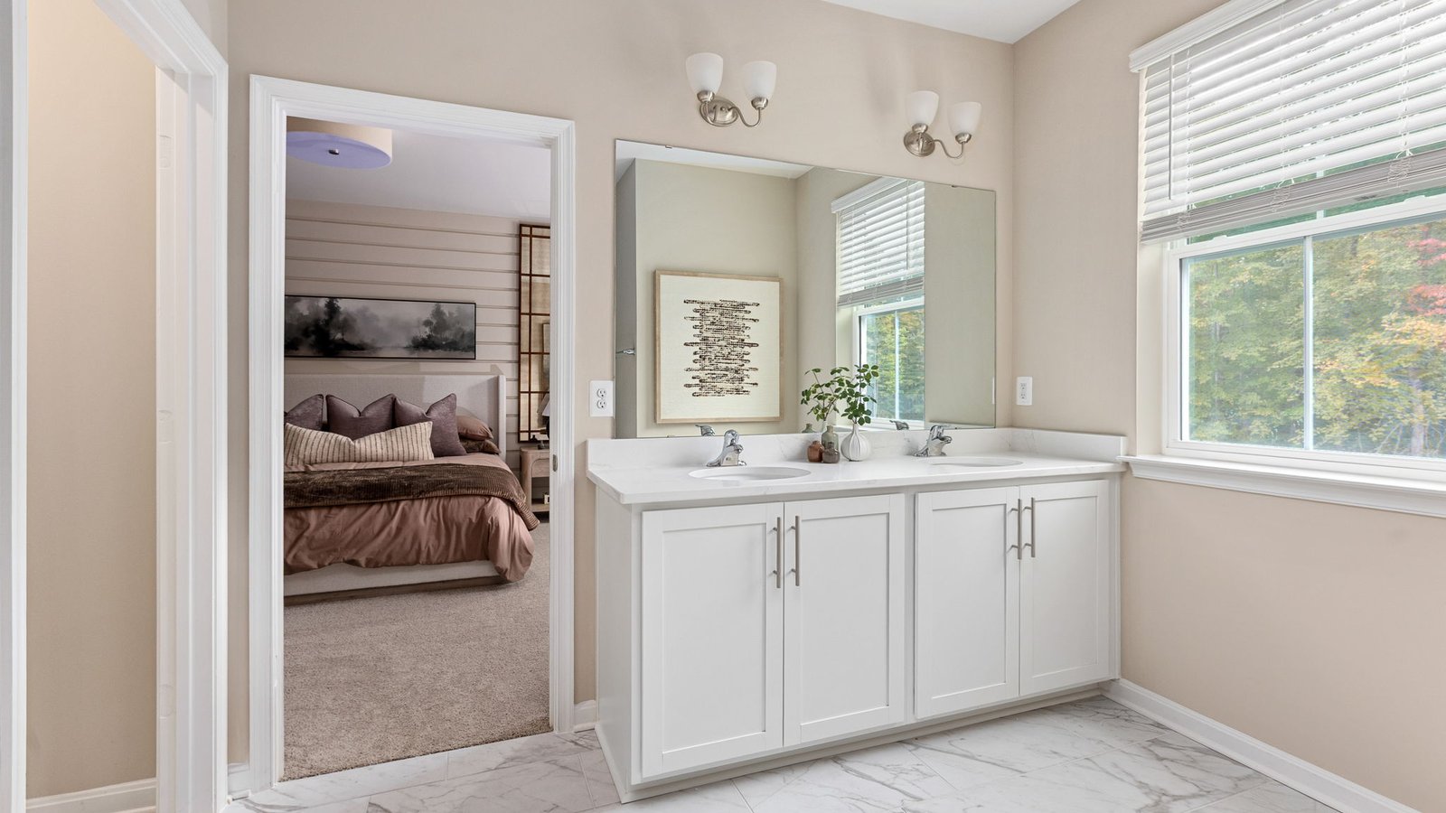 Modern primary bathroom in a new King George, VA home with dual vanities and a spacious shower.