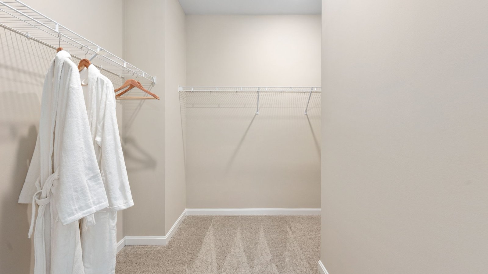 Spacious walk in closet in primary bedroom in a new single-family home in King George, VA.