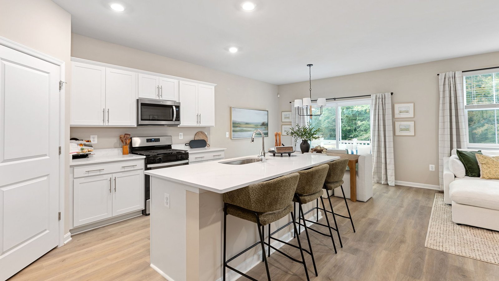 Modern kitchen in a new King George, VA single-family home with a large center island and open layout.