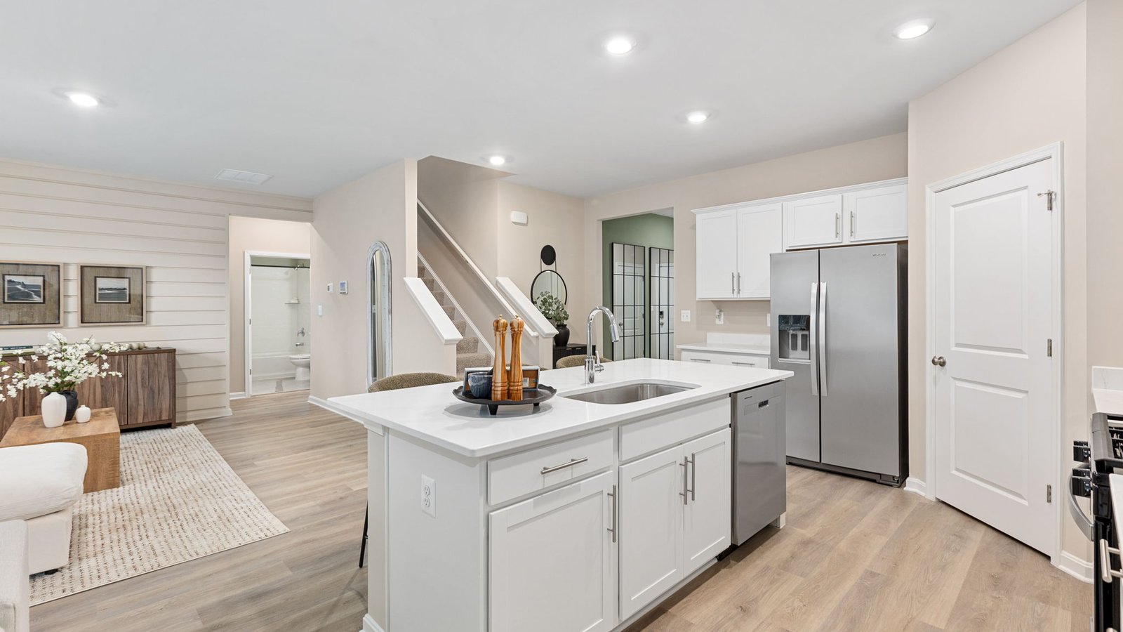 Modern kitchen in a new King George, VA single-family home with a large center island and open layout.
