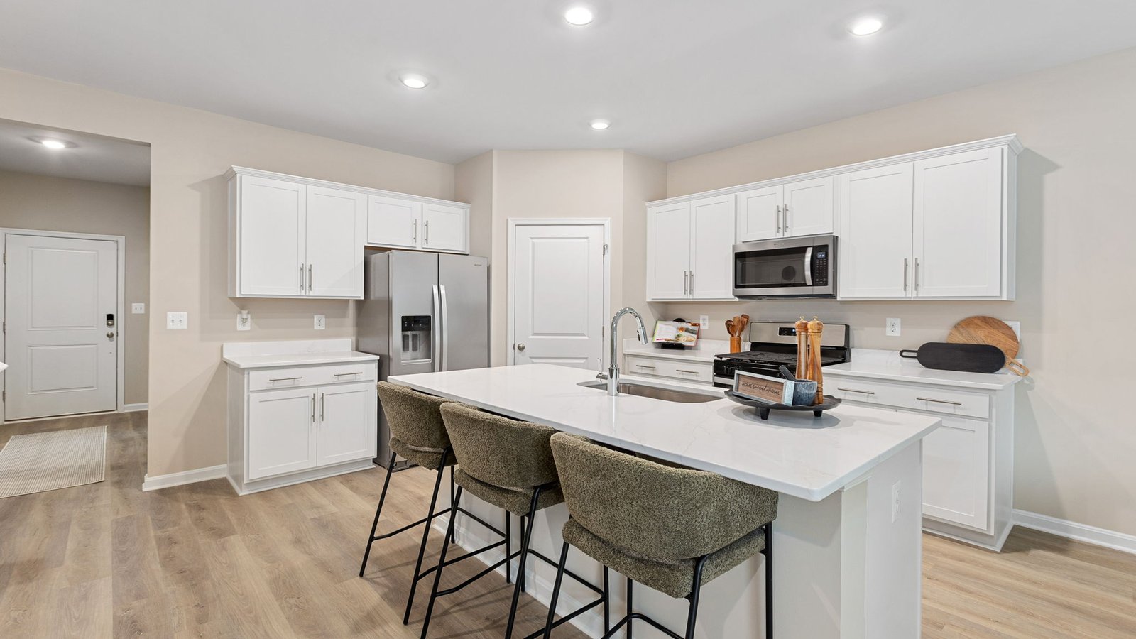 Modern kitchen in a new King George, VA single-family home with a large center island and open layout.