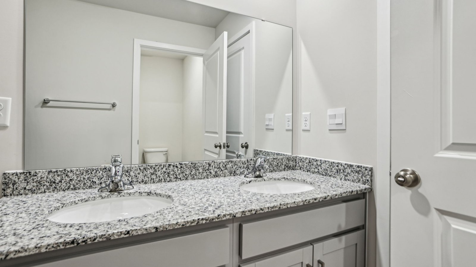 secondary full bathroom with dual sink vanity