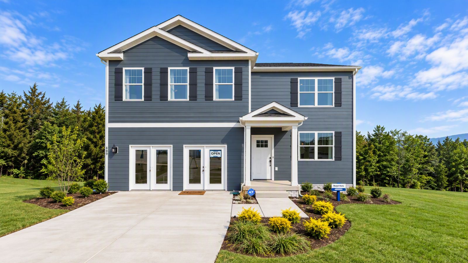New construction home in Staunton VA featuring modern curb appeal, stone accents, covered front porch, and attached garage in the scenic Shenandoah Valley.