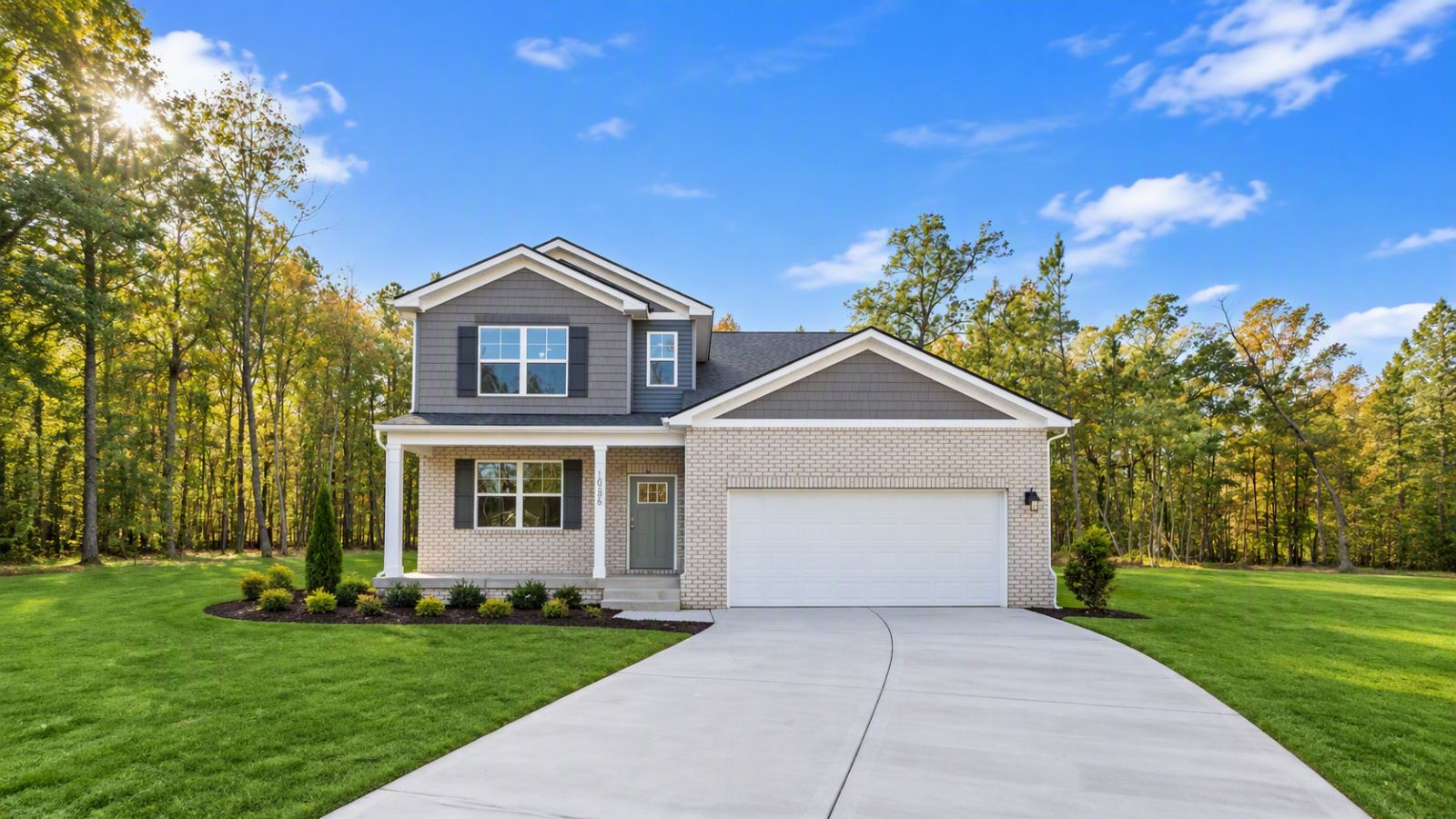 New construction home in Staunton VA featuring modern curb appeal, stone accents, covered front porch, and attached garage in the scenic Shenandoah Valley.
