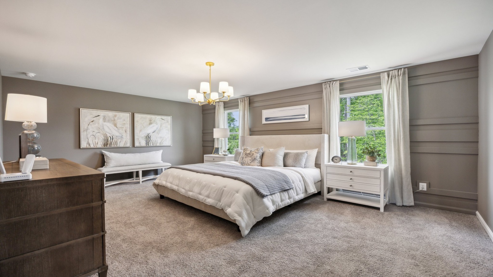 Primary bedroom designed for privacy and space with a convenient flow into spa-inspired ensuite bathroom and walk-in closet