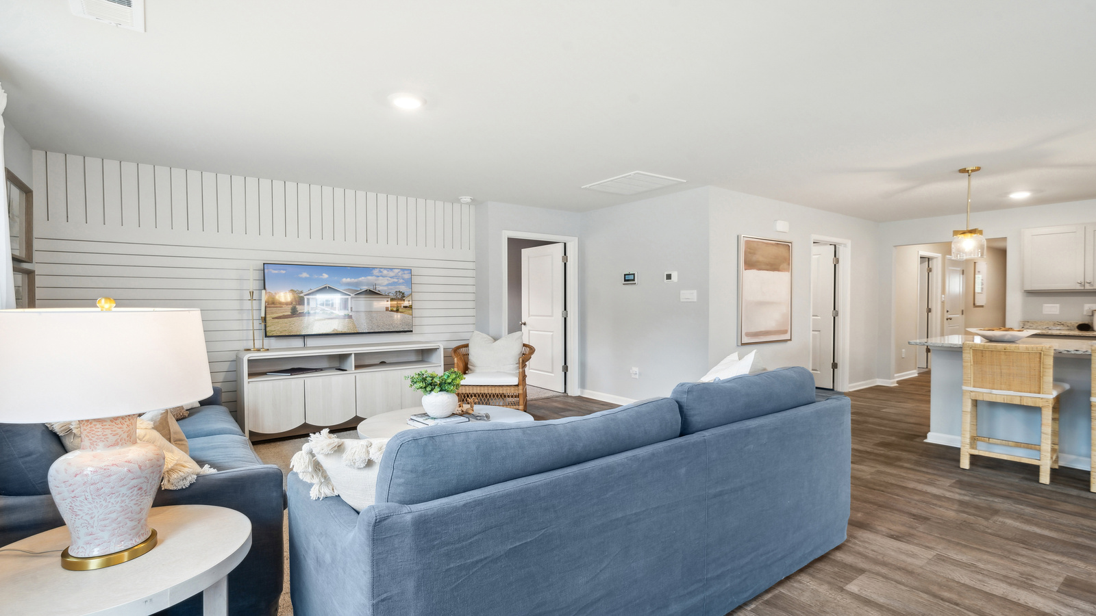 Main front level living room adds a bright space, open concept connections to kitchen, living spaces, stairs, backyard