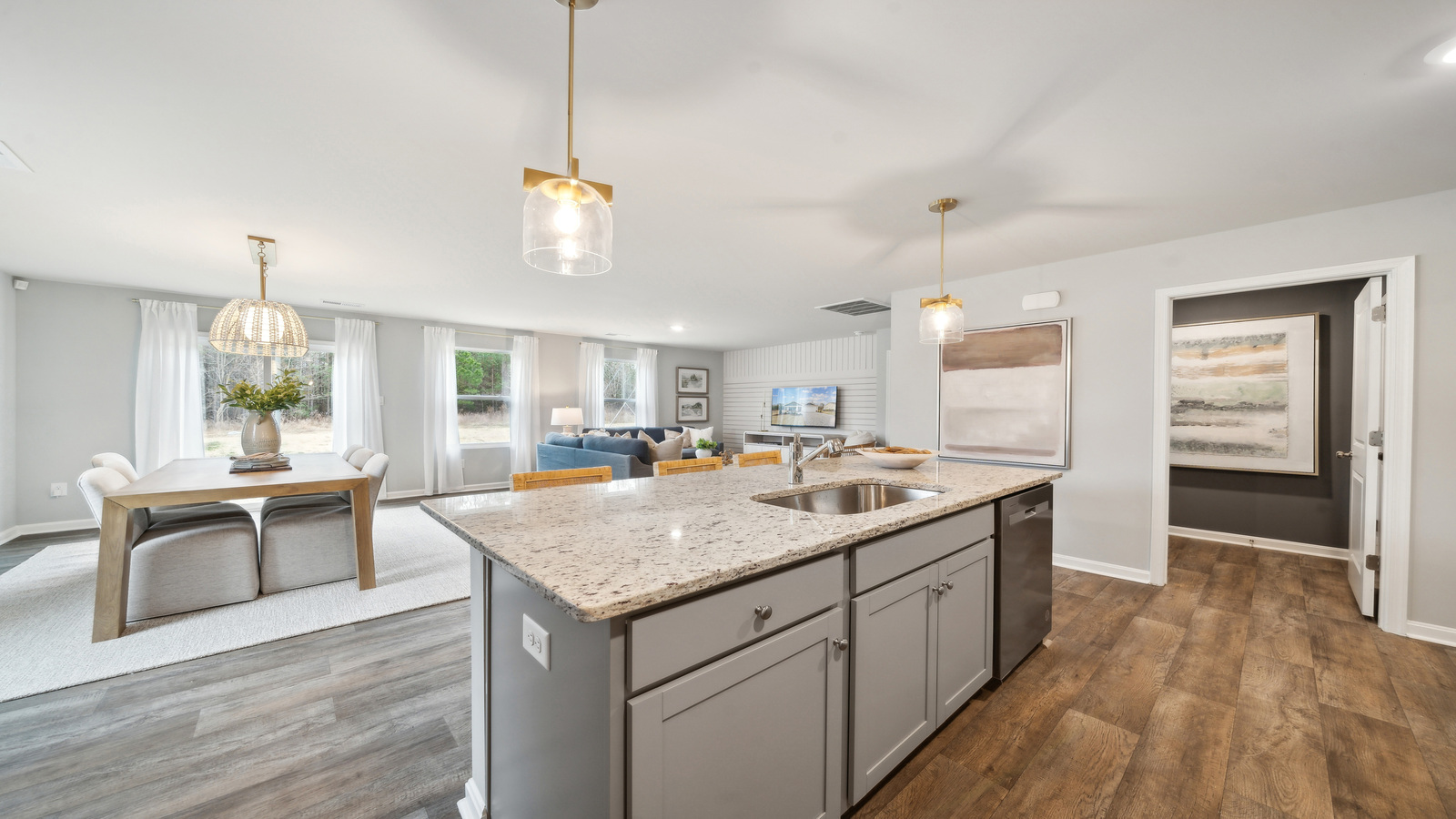 New home kitchen island with seating, pantry, ample cabinet storage, new appliance suite, multi-prep zones, outdoor access