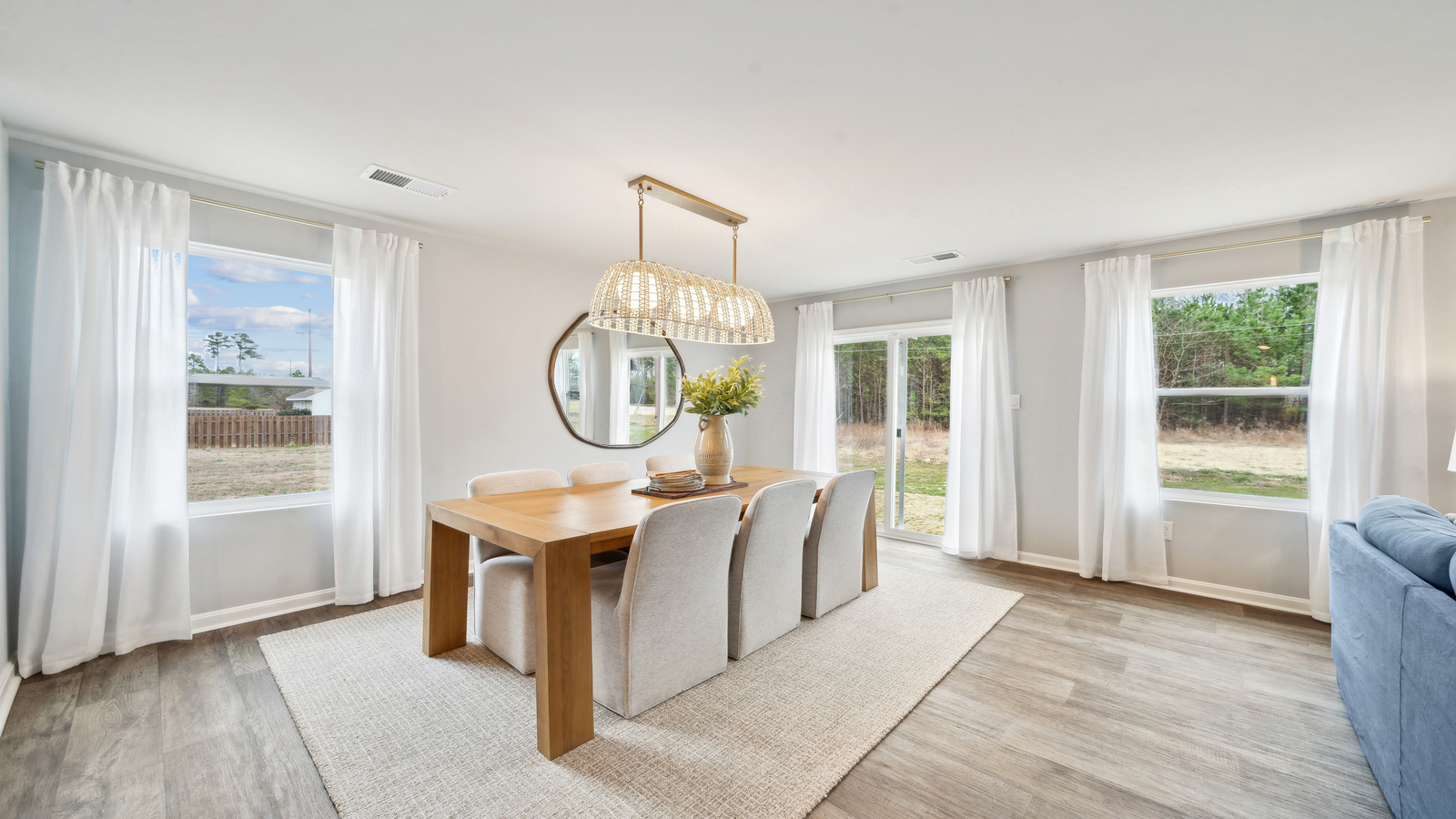 Modern dining room in new home offers backyard visibility, living and kitchen connections Eagle Ridge