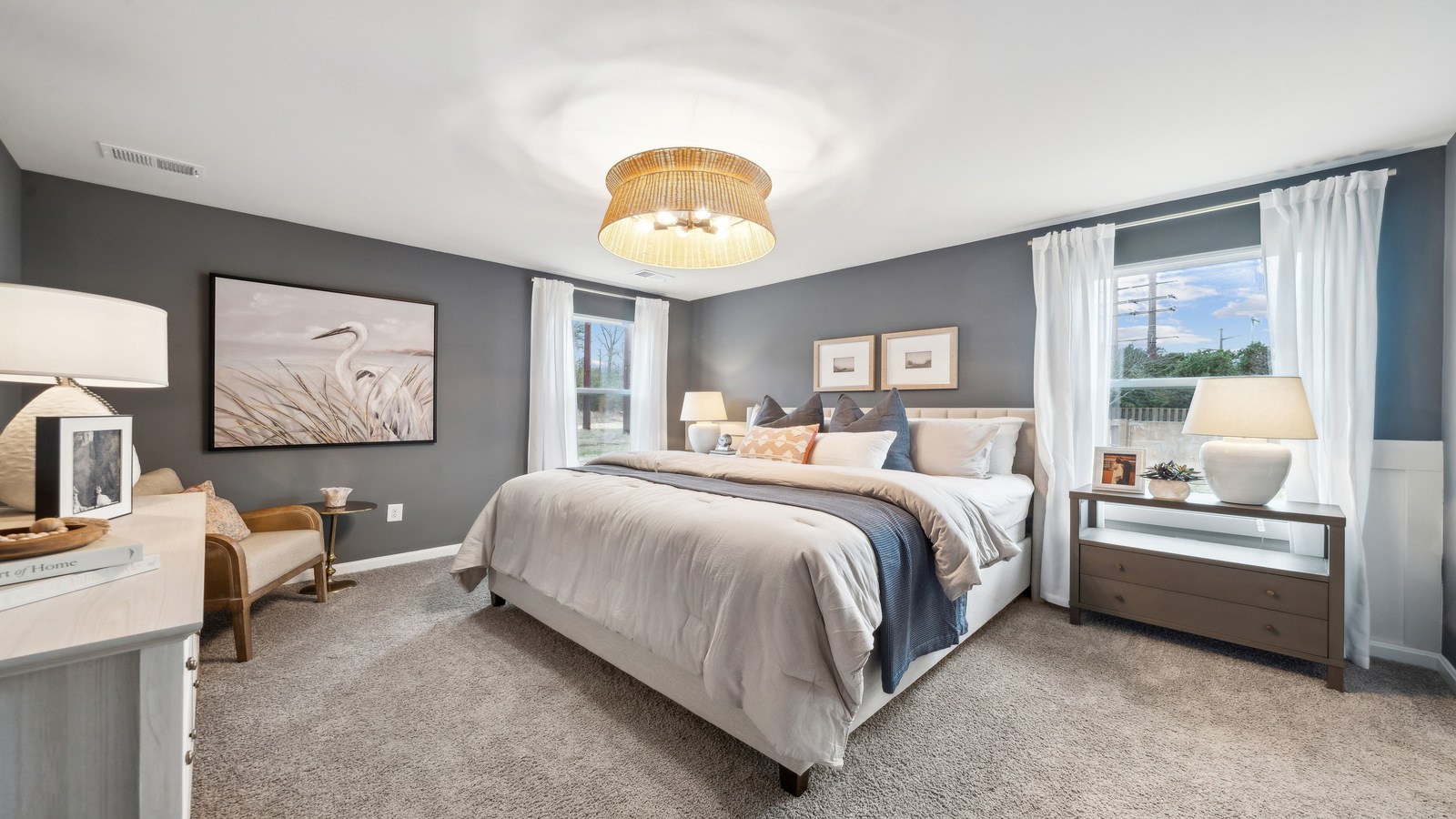 Bright and open owner's bedroom in Eagle Ridge overlooking the backyard, spa-inspired ensuite bathroom, walk-in closet