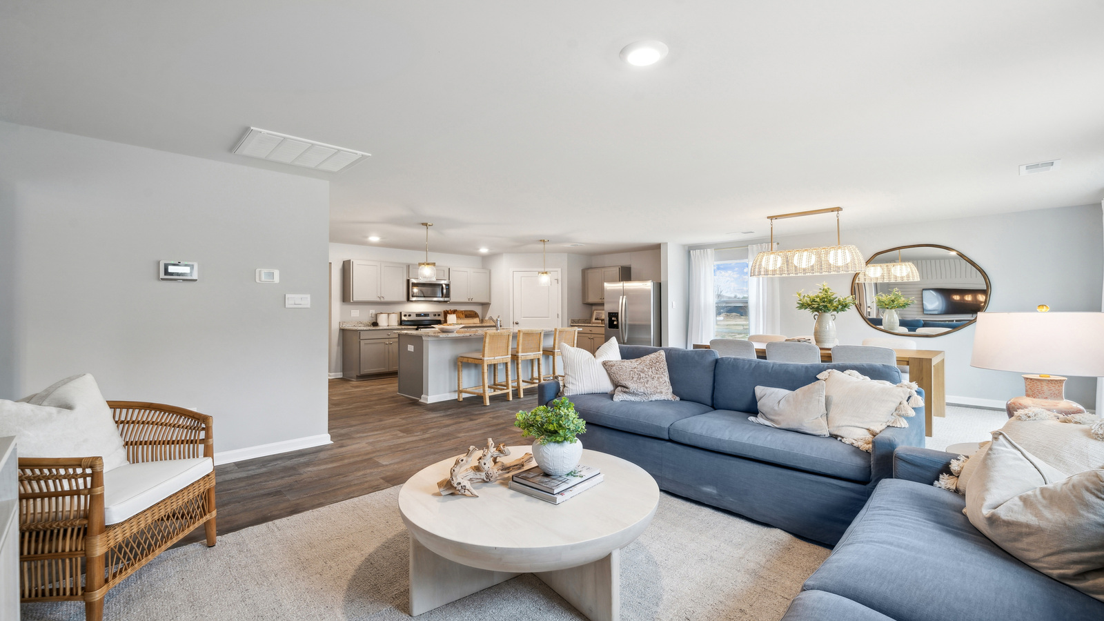 Living room features quality throughout, fresh open concept flow to the kitchen - dining areas, Eagle Ridge