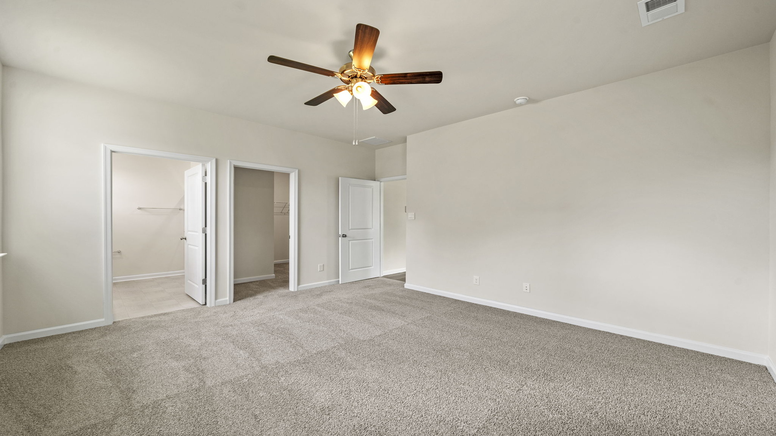 Owner’s suite offers natural window light, spa-inspired ensuite bathroom, backyard view, walk-in closet for everyday style