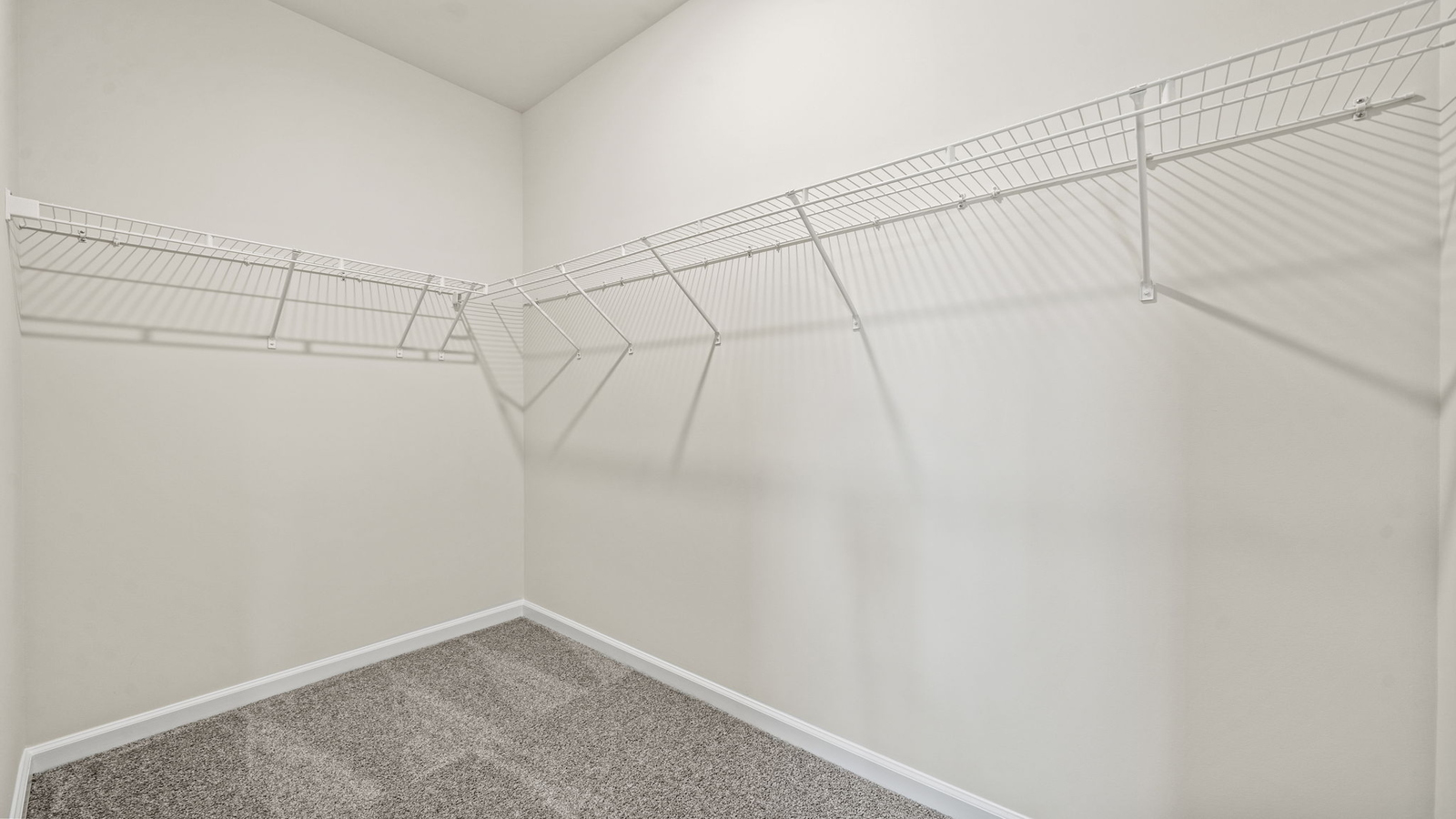 New home primary walk-in closet adds crafty organized space designed by D.R. Horton in Eagle Ridge