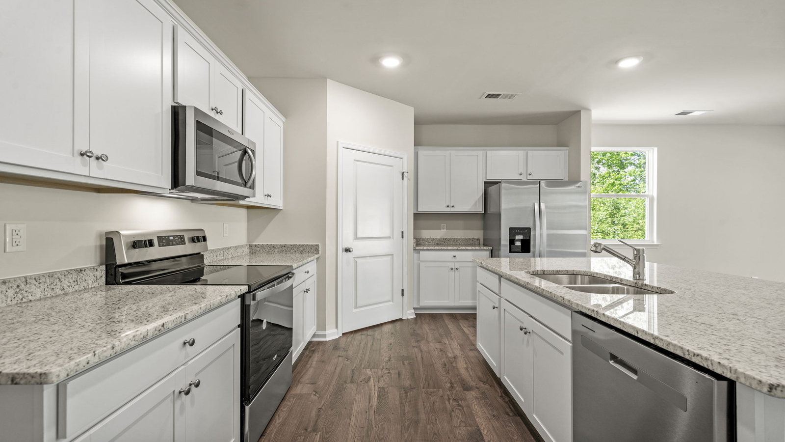 New appliances and larger kitchen island with seating anchor the kitchen, next to dining, family rooms provide stylish designs