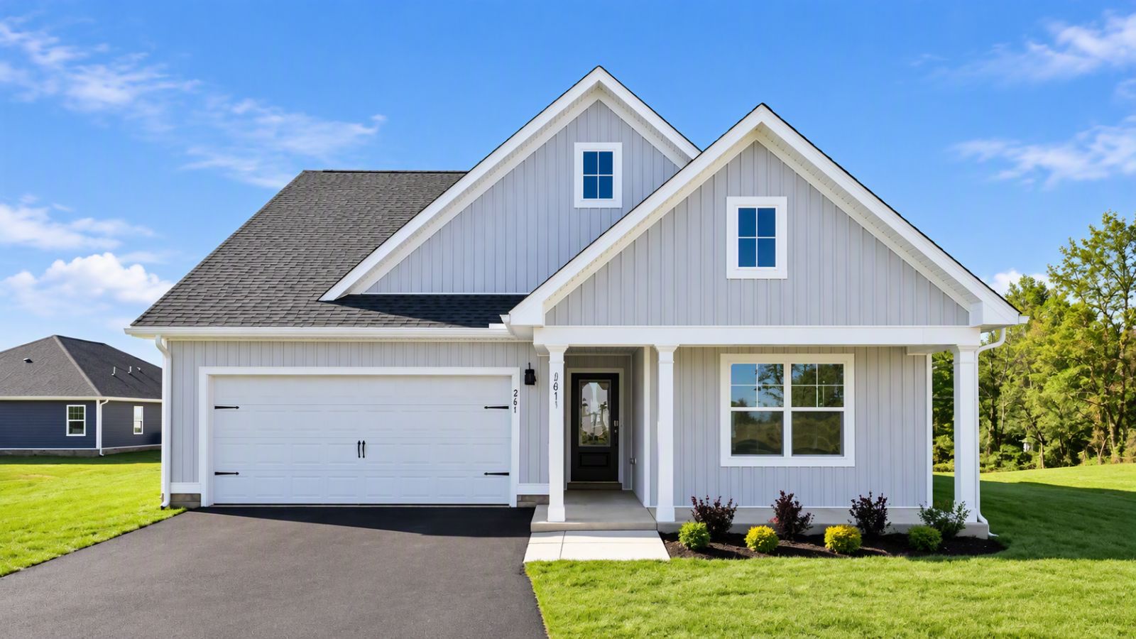 New single-family home in Staunton VA featuring modern architecture, attached garage, landscaped yard, and mountain-view surroundings.