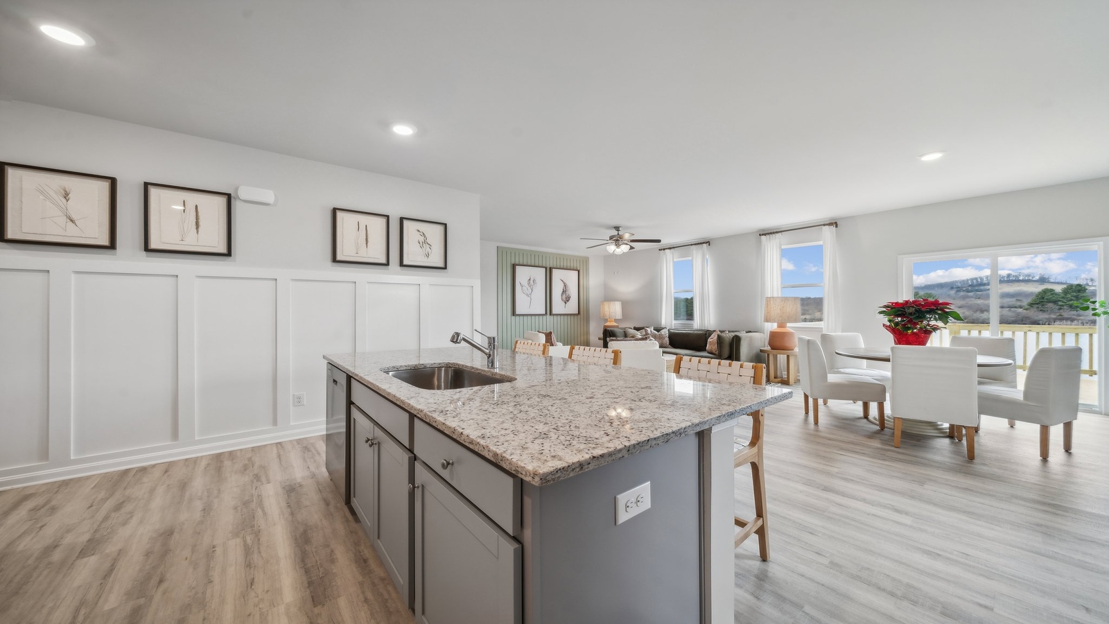 Central kitchen island with seating anchors our main level with meal prep zones, new appliance suite, dining-living areas