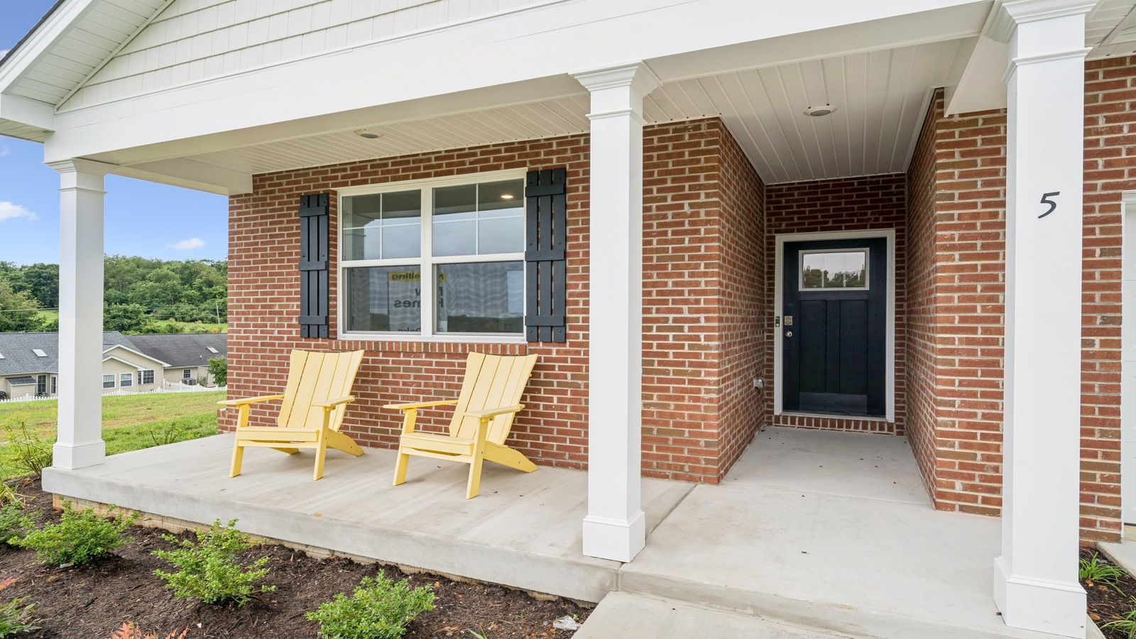Street view of Front Door and Porch with main living access with sightlines in Red Oaks