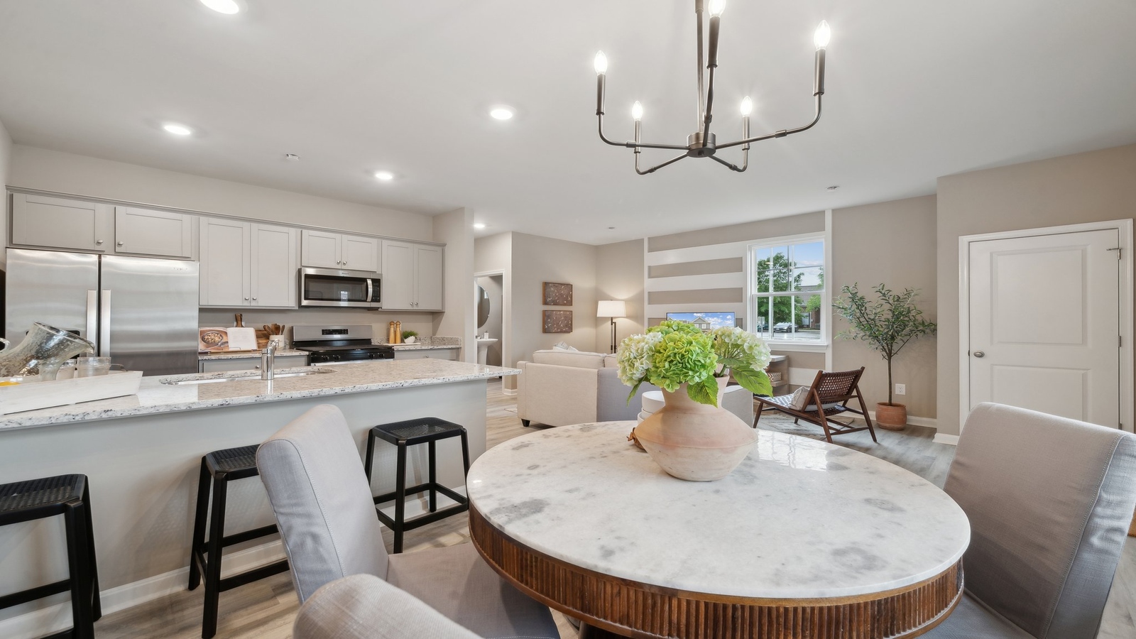 Dining room at Watermark new home, next to the kitchen and connected to main living areas