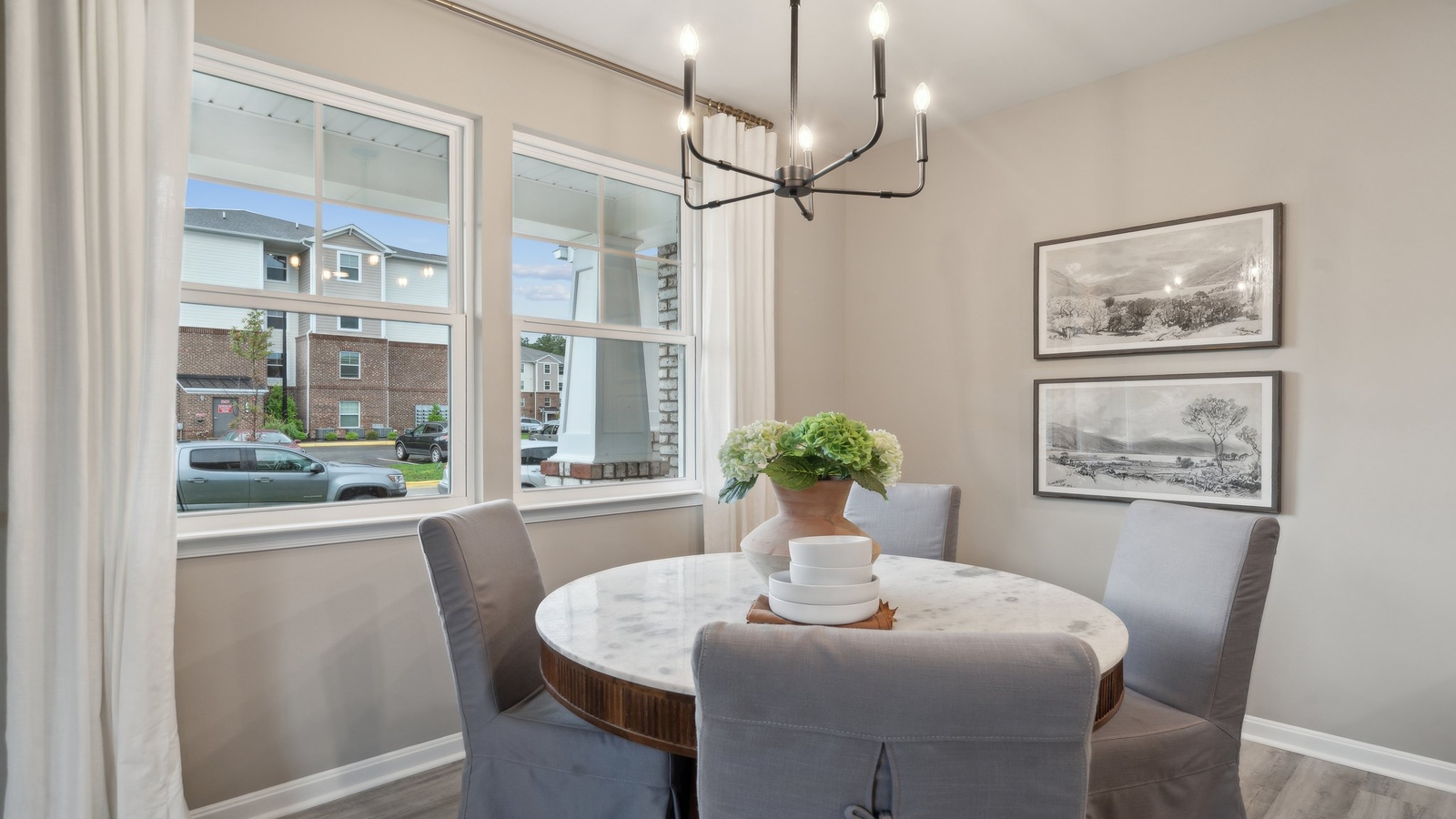 Dining room in Watermark new townhome showcases our fresh open concept connectivity to main areas, stairs, front entry