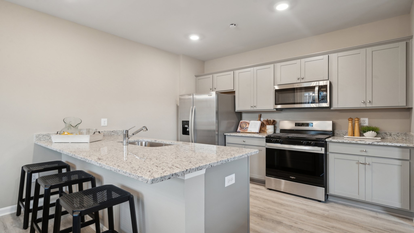 Central kitchen island adds seating, designed to anchor the home, pantry, prep zones, perfect for entertaining, everyday life
