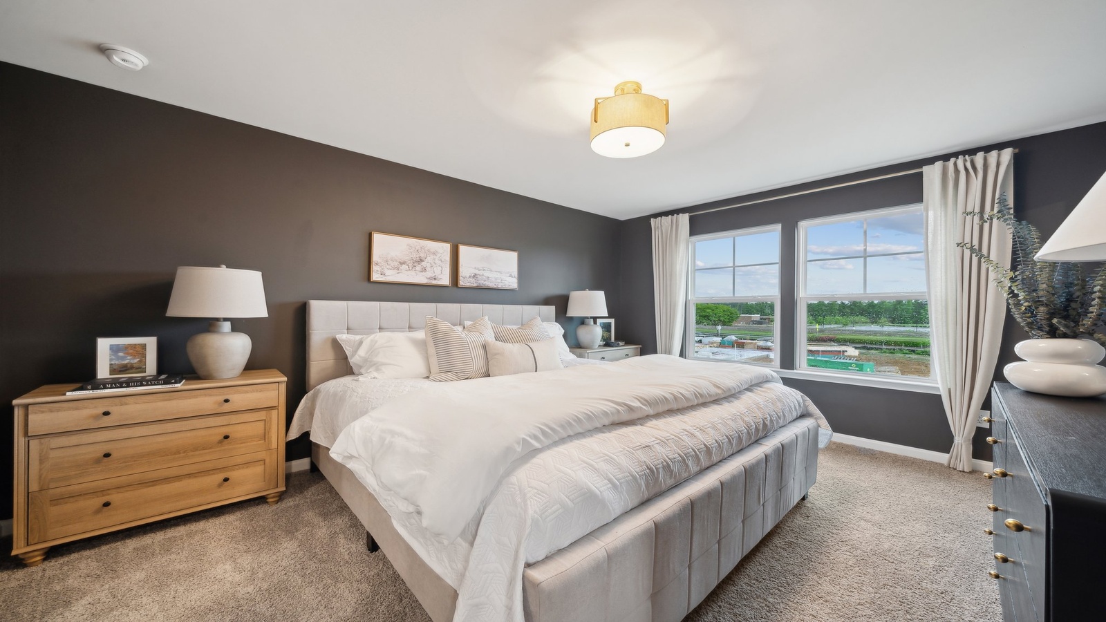 Bright and open primary bedroom in Chappell Creek with walk-in closet, stylish ensuite bath, overlooking backyard