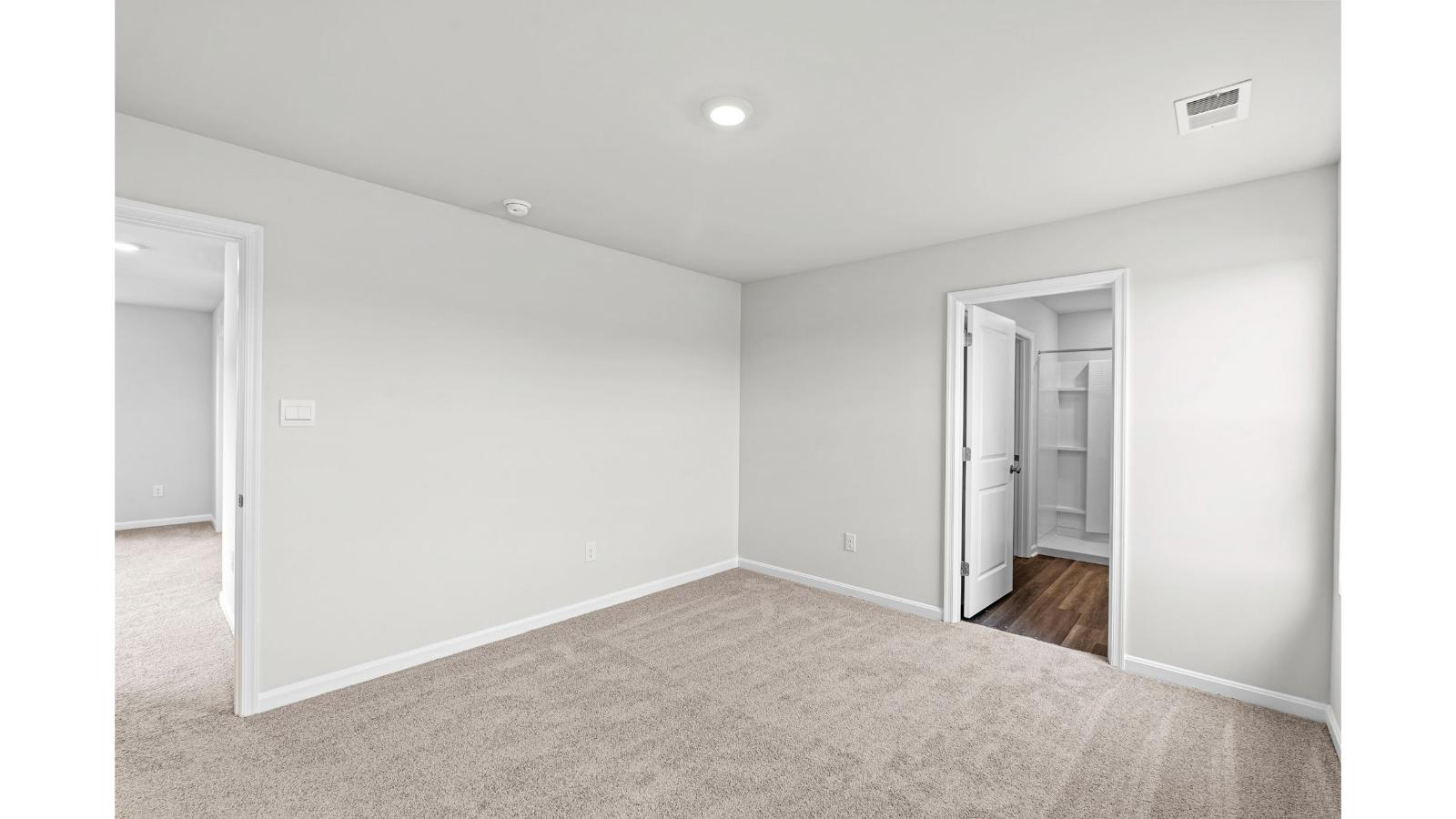 Owner’s suite offers natural light, spa-inspired en-suite bathroom, walk-in closet for everyday comfort