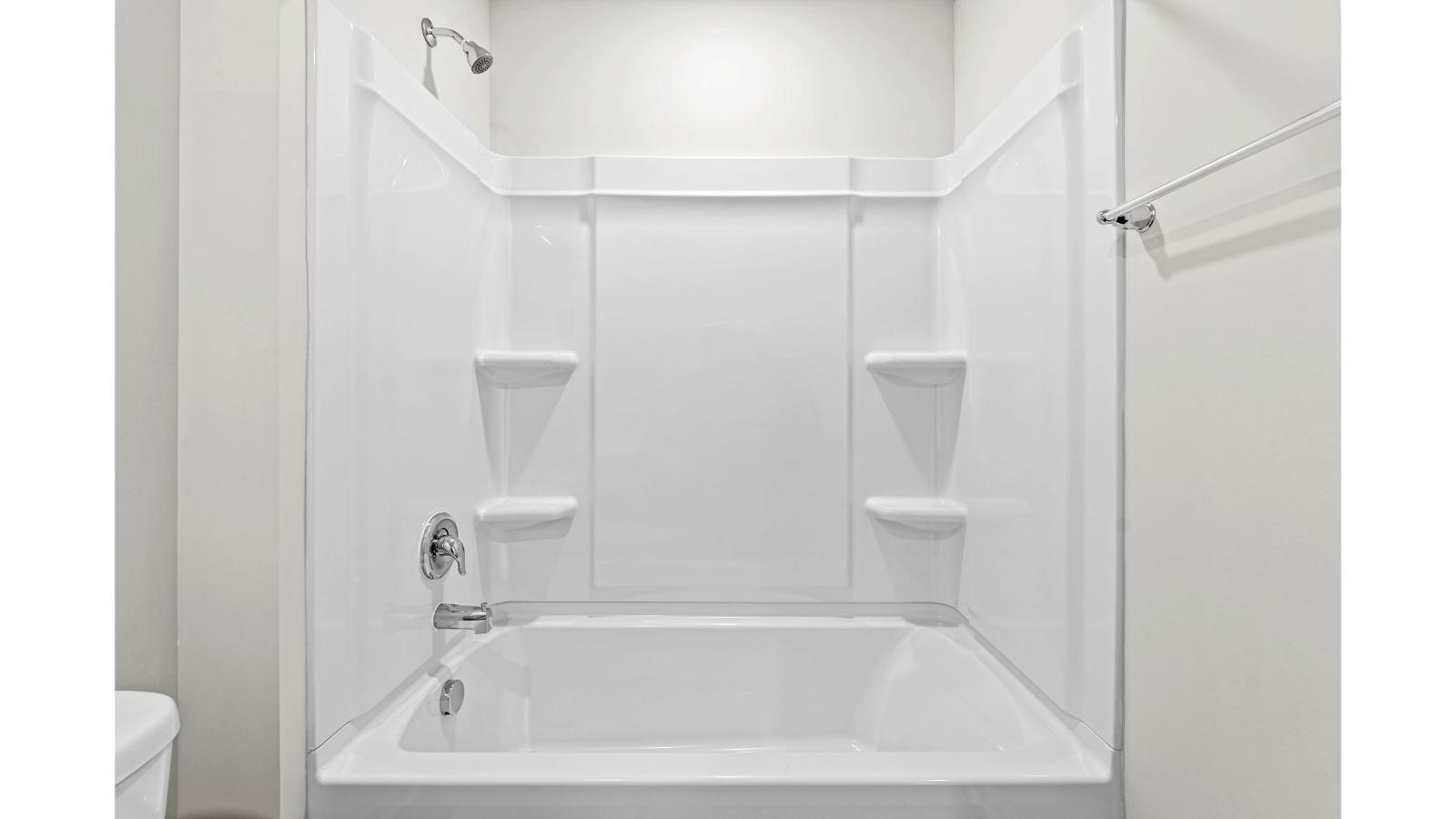 Family shower-bath, modern cabinetry, chrome faucet, hard surface counter at Arbors at Farms of New Kent by D.R. Horton