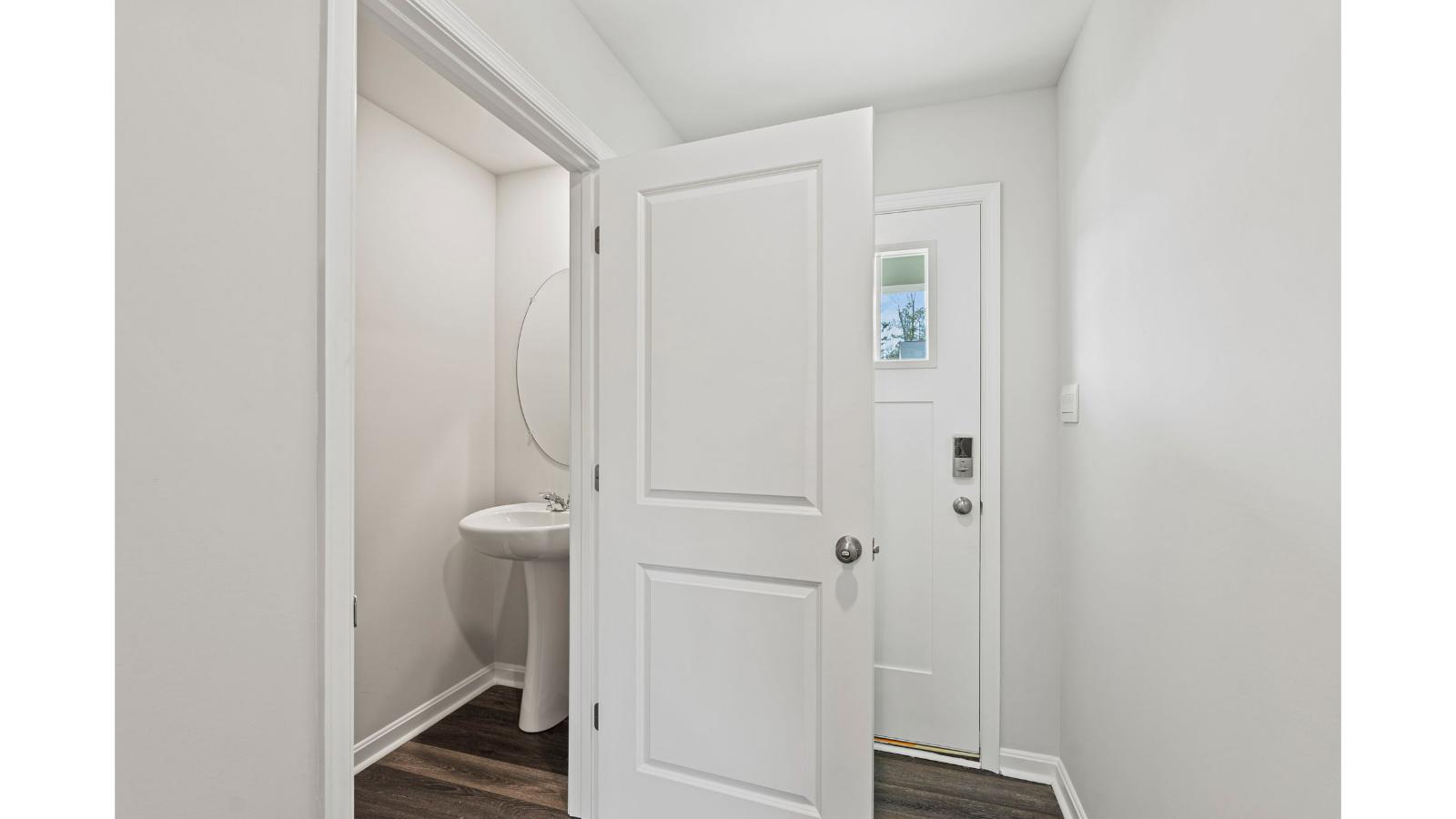 Cozy secondary bedroom with privacy door, closet, and hallway connection to shared bath