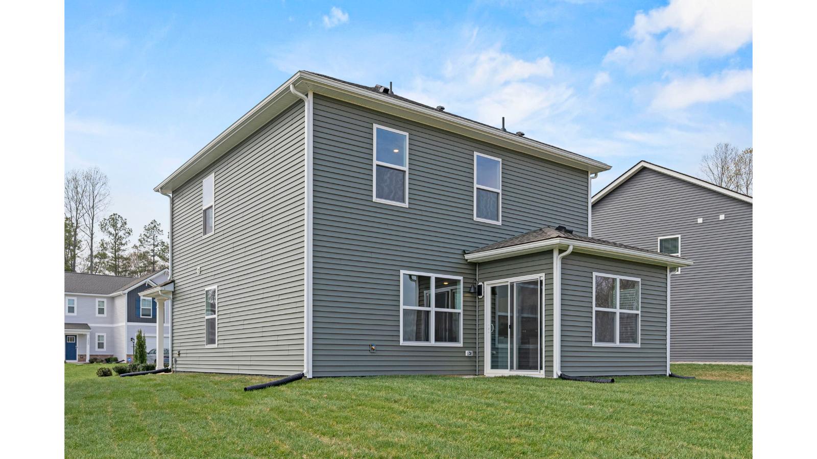 Outdoor living area includes, flat backyard, and rear-facing windows from the main level