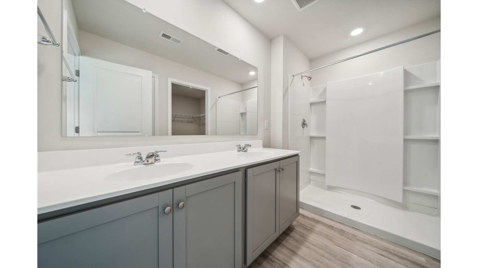 Our new home ensuite design with step-in shower, bright overhead lighting, full length vanity, walk-in closet