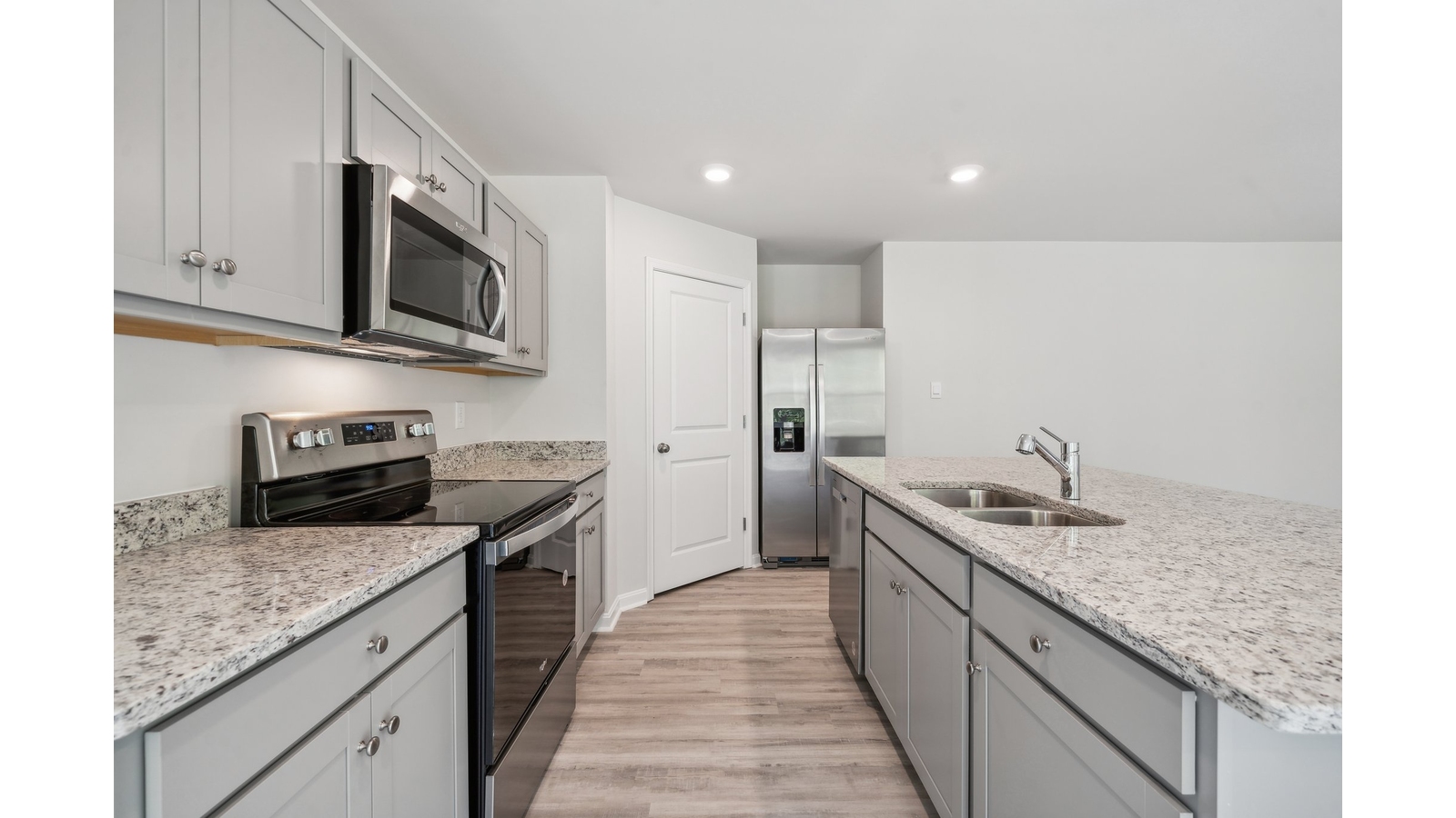 Spacious island ideal for casual dining, cooking prep, ample storage and entertaining in our Modern Design layout