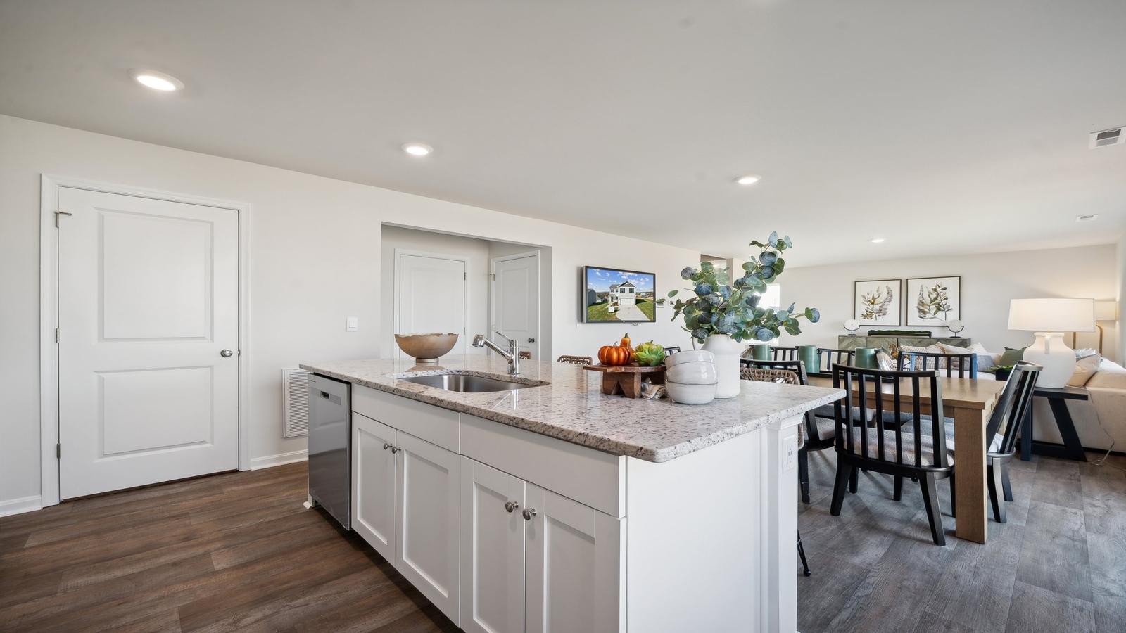 Sleek kitchen island with brand-new appliances and open view to accessed great room-dining room