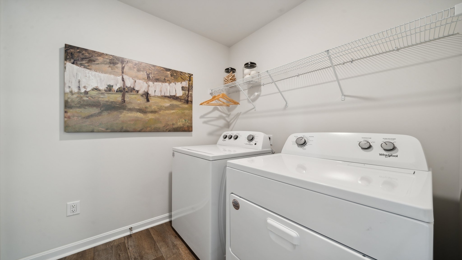 Arbors at Farms of New Kent home utility laundry room with smart overhead shelving options crafted by D.R. Horton