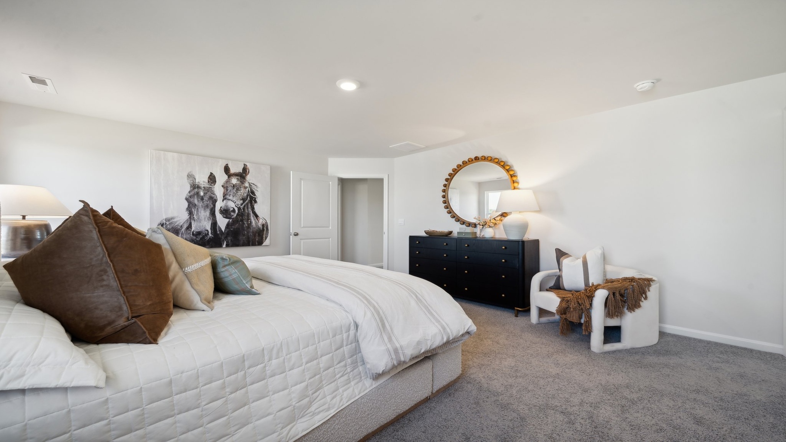 Primary suite includes separation from other bedrooms, in this modern-designed floor plan with ensuite and walk-in closet