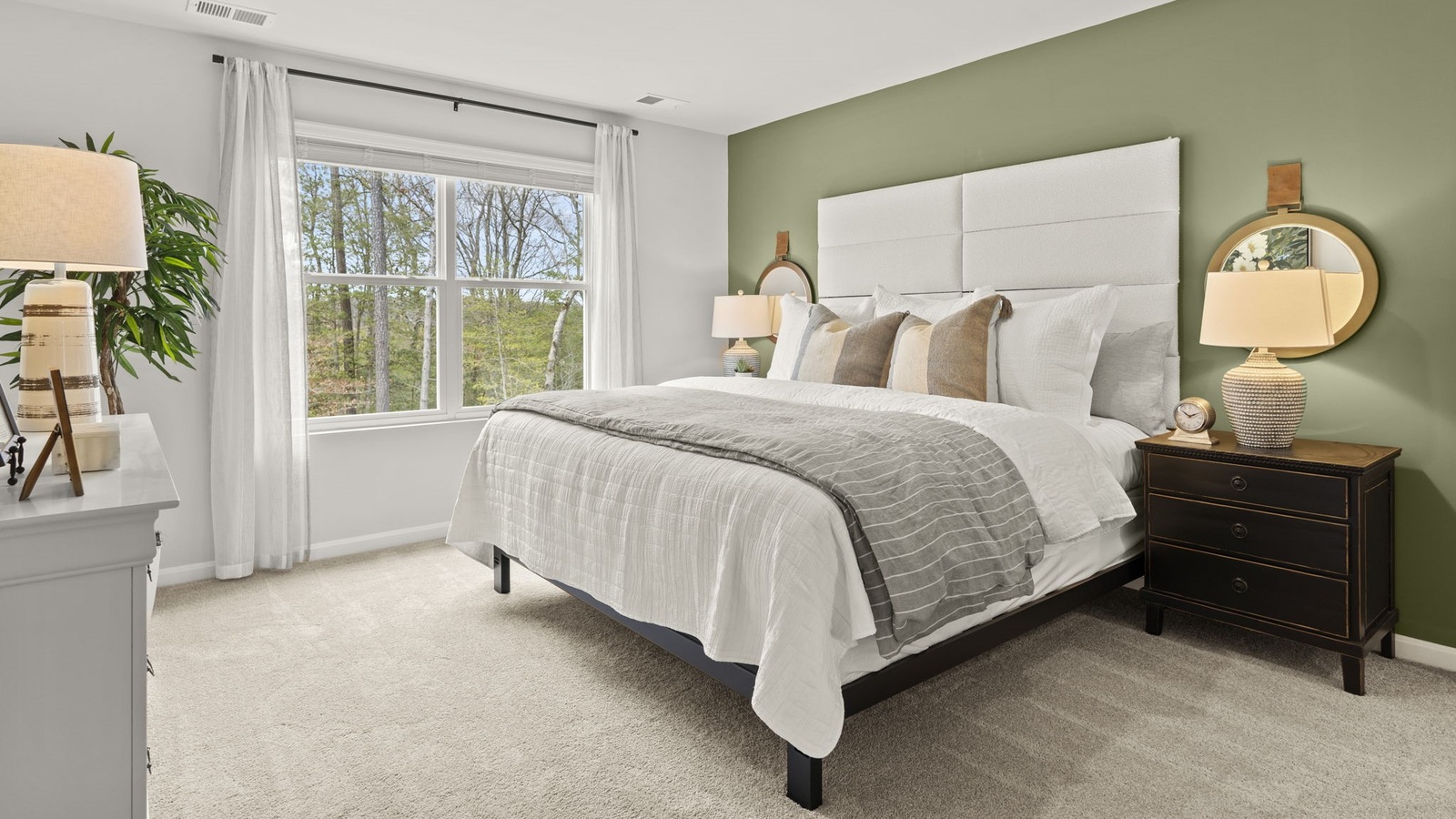 Owner’s suite offers natural light, spa-inspired en-suite bathroom, walk-in closet for everyday comfort