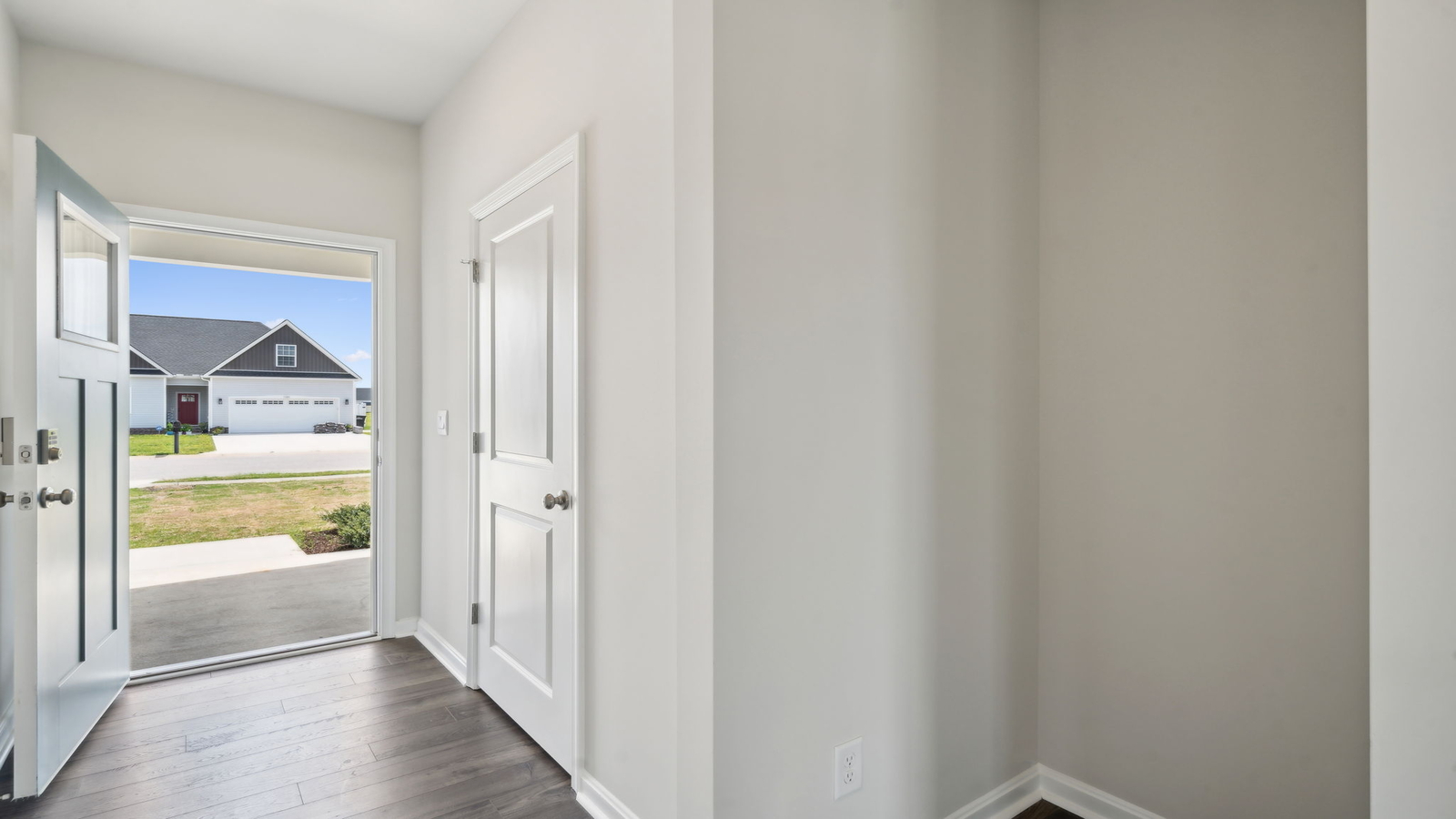 Our New Home includes an entry hallway, Stairway upstairs designed for connecting the front to the main gathering areas