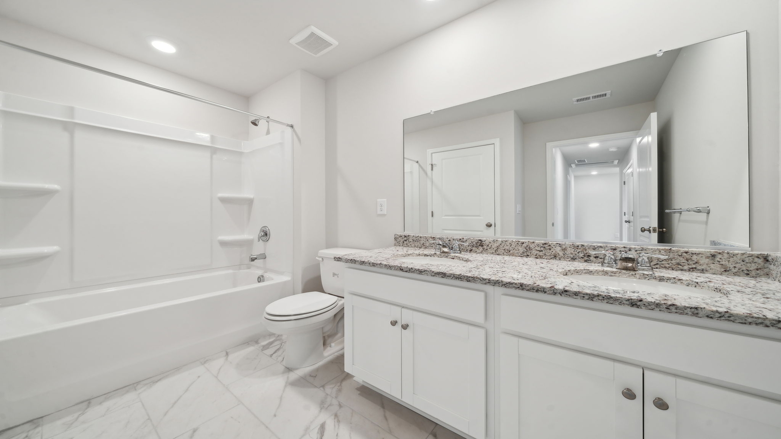 Full bathroom with tub and shower surround and transom window for light and privacy at Arbors at Farms of New Kent