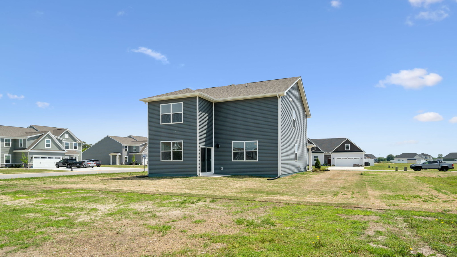 Backyard in this New Home with full lawn, and fencing potential for added privacy