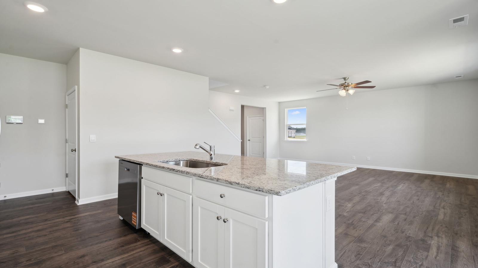 Bright kitchen with center island, Pantry, hard surface countertops, brand-new appliances in Arbors at Farms of New Kent