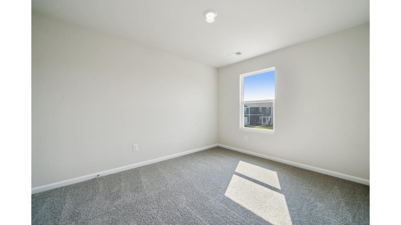Primary bedroom in this New Home features ample space, double windows, soft carpet, a Walk-in Closet, private En-Suite Bath