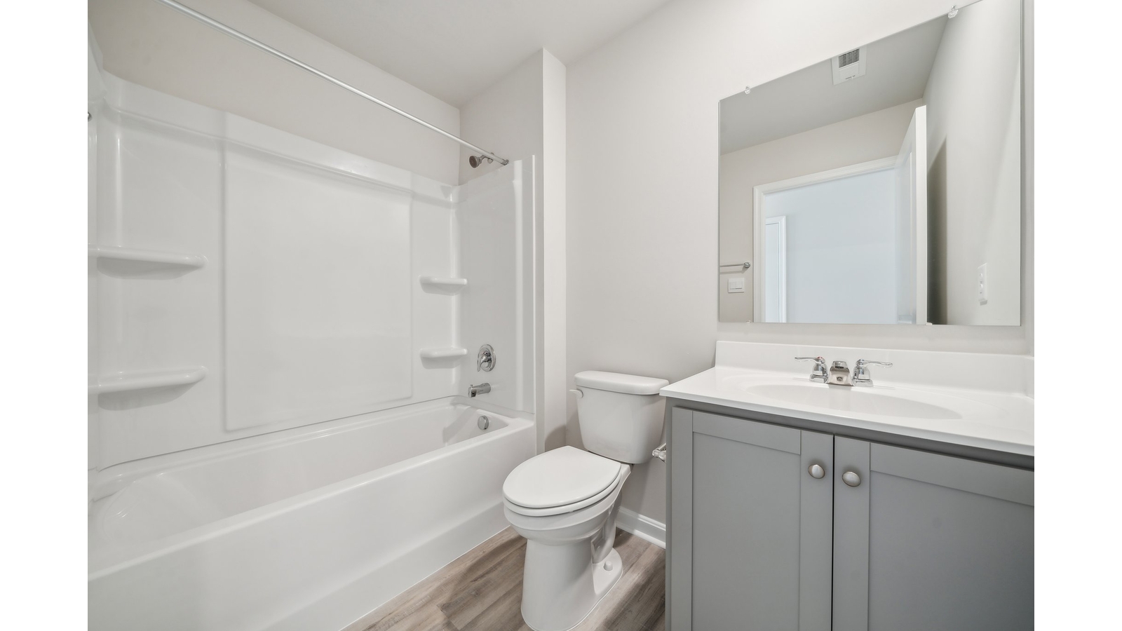 Family shower-bath, modern cabinetry, chrome faucet, hard surface counter at Arbors at Farms of New Kent by D.R. Horton