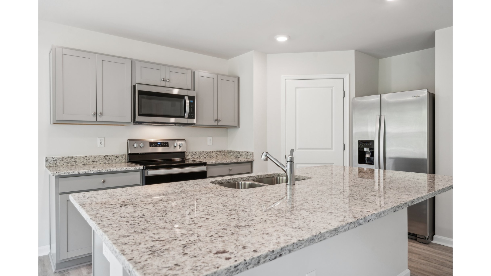 Spacious Kitchen island in this New Home, ideal for dining, daily prep, entertaining in our Fresh Modern Design layout