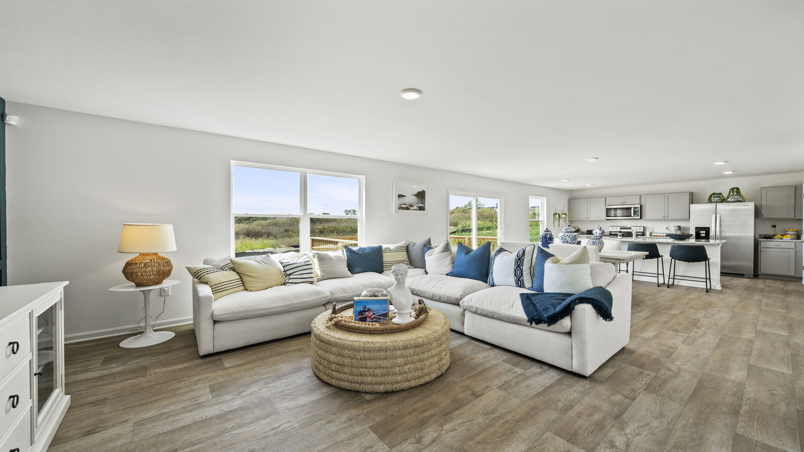 Living, dining areas and kitchen combination with new appliance suite and accessibility options in Chappell Creek