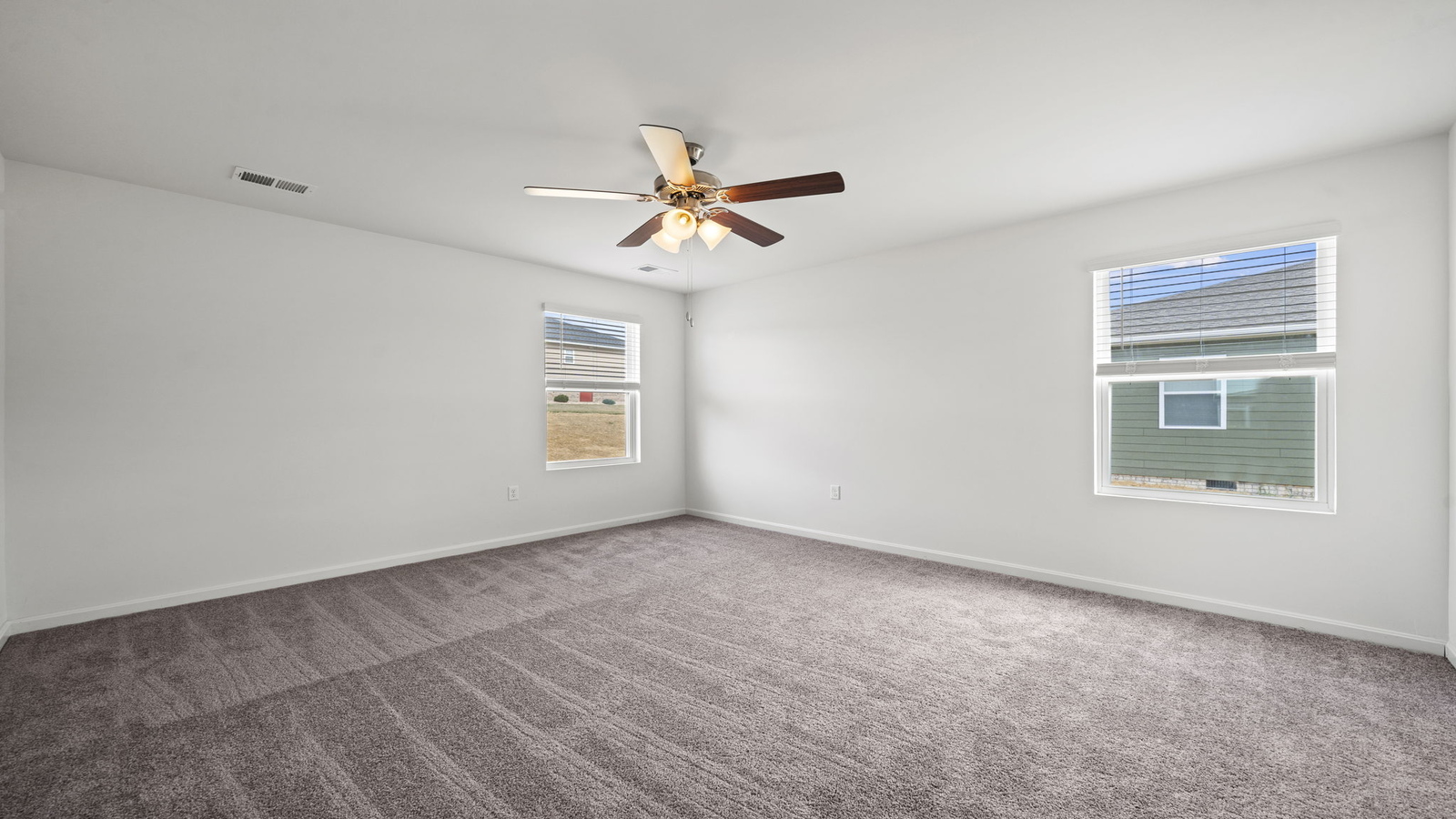 Owner’s suite offers natural window light, spa-inspired ensuite bathroom, backyard view, walk-in closet for everyday style