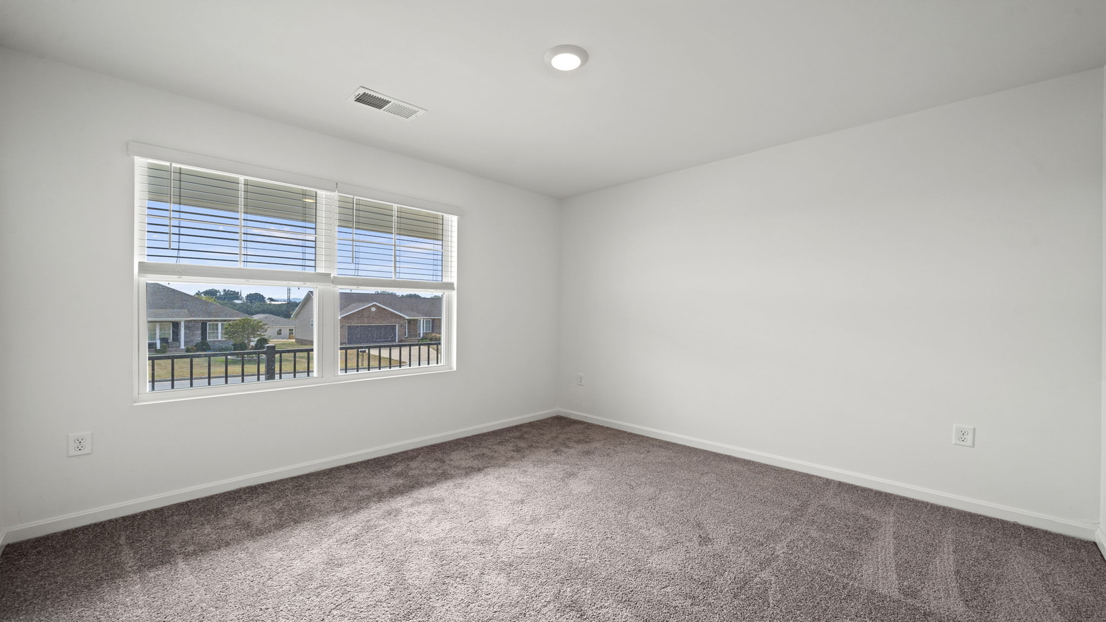 Secondary bedroom in Chappell Creek showcases quality designs with closet space, soft window light, upstairs connectivity
