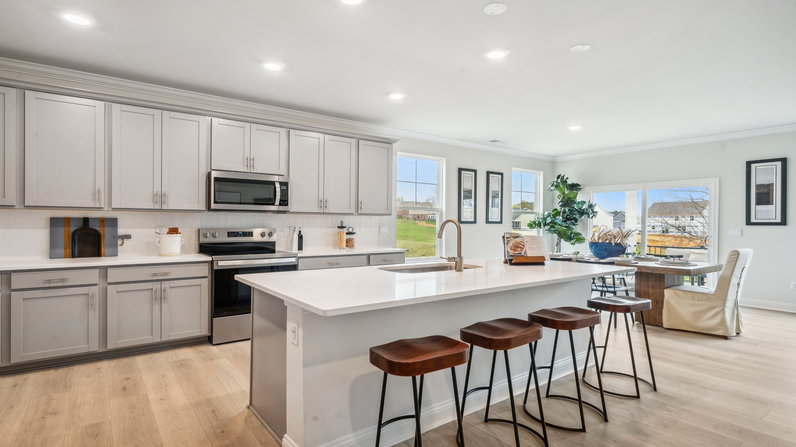 Island kitchen design offers Fresh Open Concepts with New appliances and ample storage Copper Grove at Harpers Mill