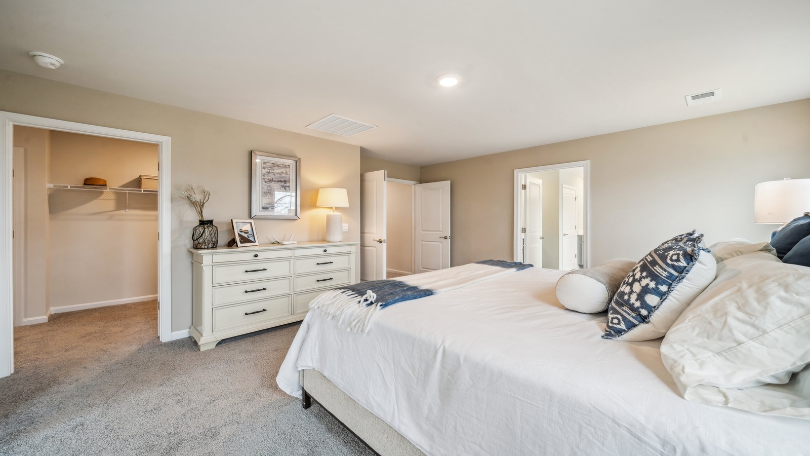 Owner’s suite offers natural light, spa-inspired en-suite bathroom, walk-in closet for everyday comfort