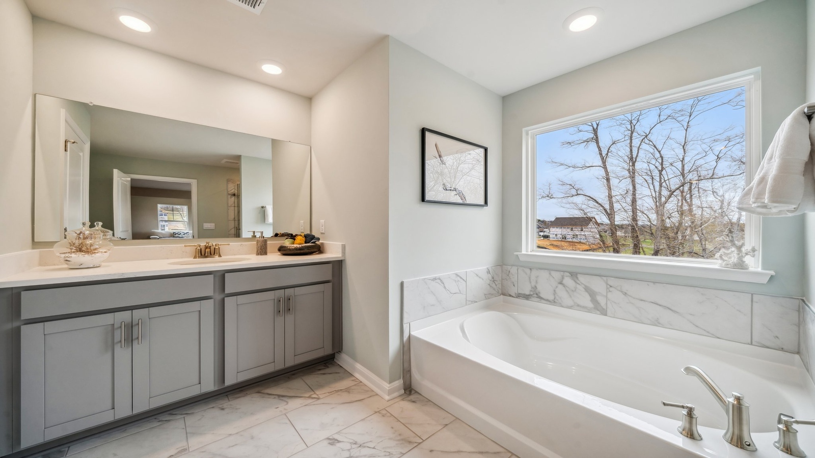 Our new home stylish ensuite design with a step-in shower, LED lighting, full-length vanity, and a walk-in closet