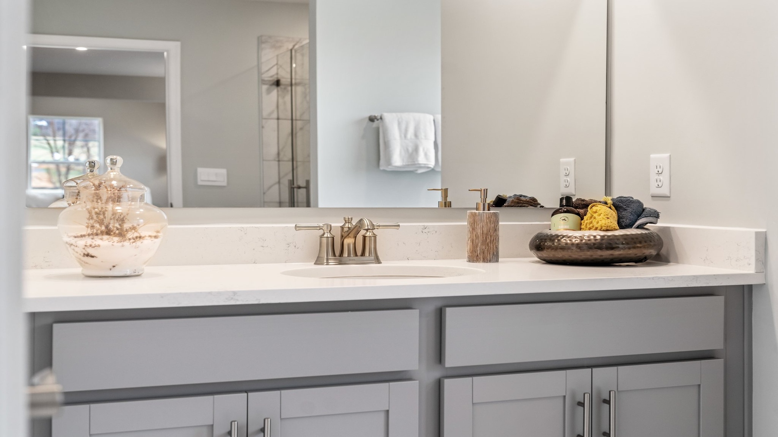 Owner’s en-suite new build home offers a functional layout with a walk-in closet, and spa-like en-suite shower-bath designs