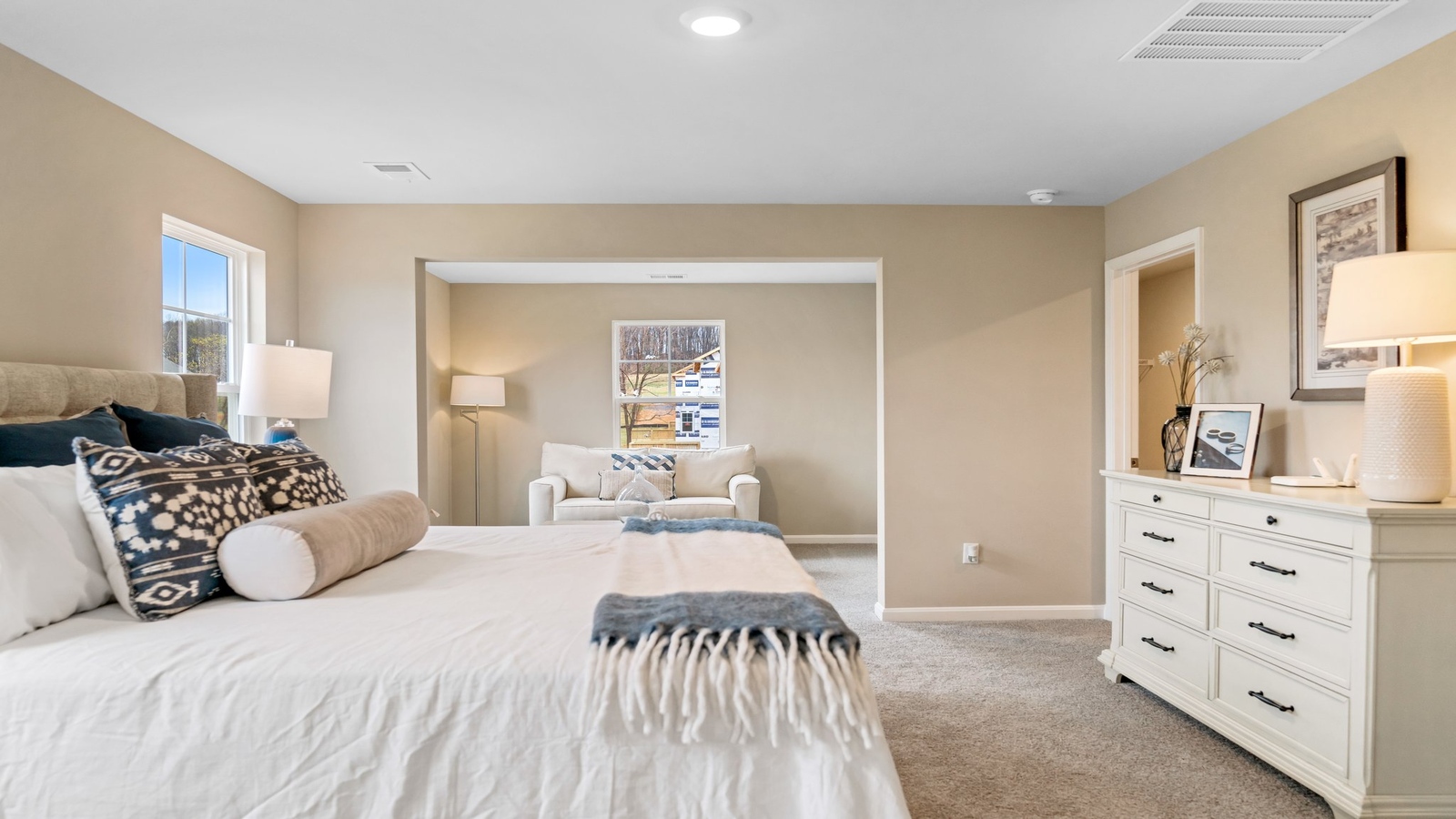 Owner’s en-suite new build home offers a functional layout with a walk-in closet, and spa-like en-suite shower-bath designs