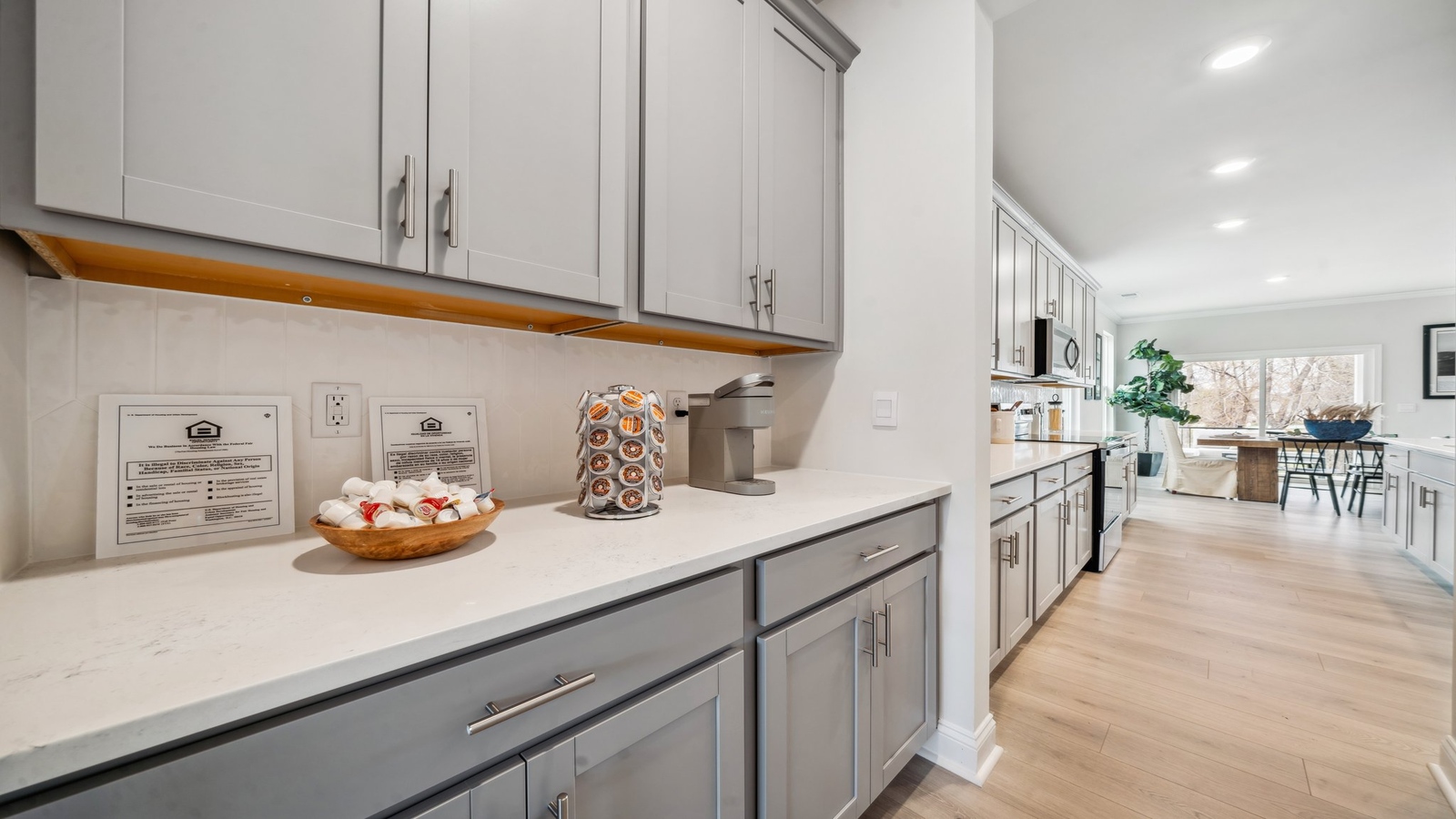 Kitchen-dining-family room combo includes Modern Design elements with wide sightlines and natural lighting throughout.